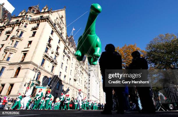 The Sinclair's Dino balloon floats down Central Park West during the annual Thanksgiving Day Parade on November 23, 2017 in New York City.