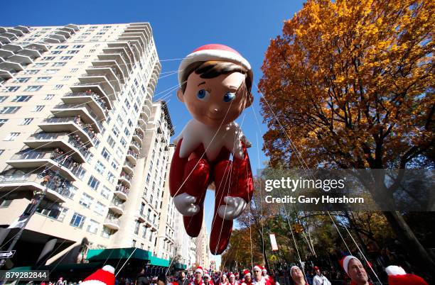 The Elf on a Shelf balloon floats down Central Park West during the annual Thanksgiving Day Parade on November 23, 2017 in New York City.