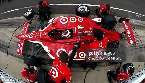 Scott Dixon, driver of the Target Chip Ganassi Dallara Honda, competes in the Indy 500 Pit Stop Challenge during Miller Lite Carb Day practice for...