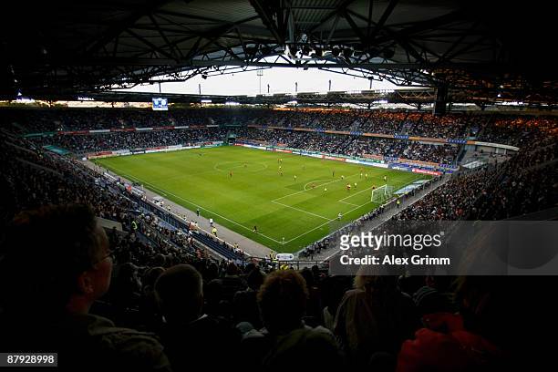 Spectators follow the UEFA Women's Cup Final second leg match between FCR Duisburg and Swesda 2005 Perm at the MSV Arena on May 22, 2009 in Duisburg,...