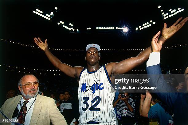 Shaquille O'Neal of the Orlando Magic celebrates after defeating the Indian Pacers following Game Seven of the Eastern Conference Finals during the...