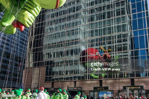 The Grinch balloon floats over Sixth Avenue during the 91st annual Macy's Thanksgiving Day Parade on November 23, 2017 in New York City.