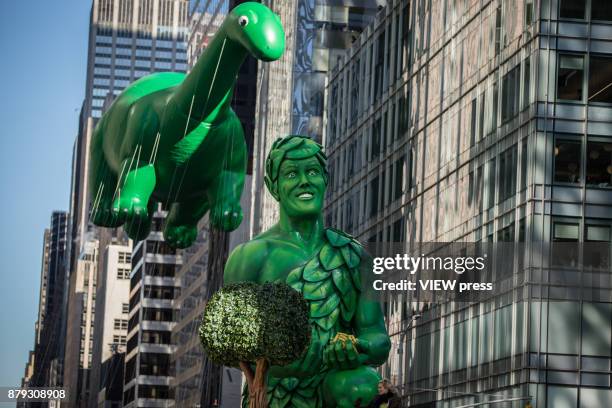 Harvest in the Valley and Sinclair's Dino float over Sixth Avenue during the 91st annual Macy's Thanksgiving Day Parade on November 23, 2017 in New...