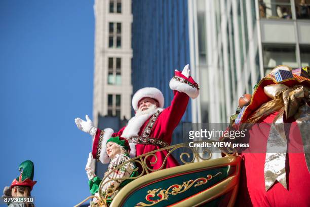 Santa Claus waves to the crowd during the 91st annual Macy's Thanksgiving Day Parade on November 23, 2017 in New York City.