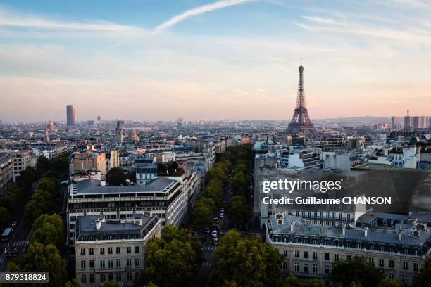 eiffel tower at sunset from the top of the arc de triomphe, paris, france - montparnasse stock pictures, royalty-free photos & images