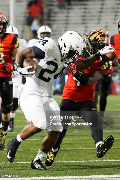 Maryland Terrapins defensive back Darnell Savage Jr. Grabs the face mask of Penn State Nittany Lions running back Miles Sanders in the fourth quarter...
