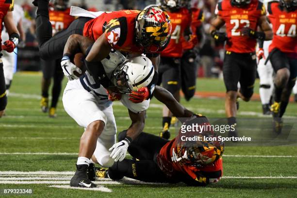 Maryland Terrapins defensive back Darnell Savage Jr. Grabs the face mask of Penn State Nittany Lions running back Miles Sanders as defensive back...