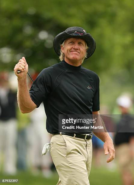 Greg Norman of Australia reacts after missing his birdie putt on the 13th hole during the second round of the Senior PGA Championship at Canterbury...