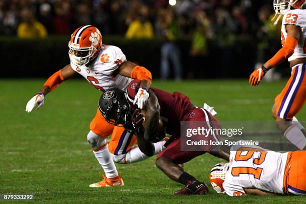 South Carolina Gamecocks running back Ty'Son Williams gets tackled by Clemson Tigers safety Tanner Muse and linebacker Dorian O'Daniel during the...