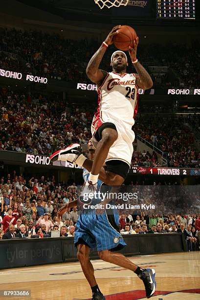 LeBron James of the Cleveland Cavaliers flies in for the shot defended by Rashard Lewis of the Orlando Magic in Game Two of the Eastern Conference...