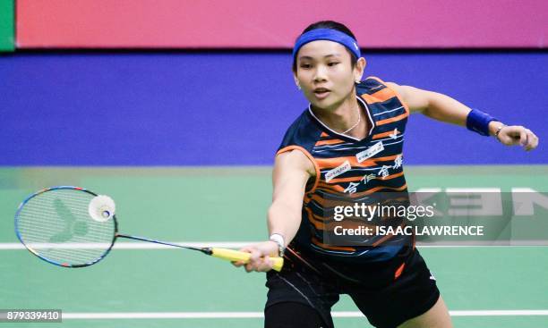 Taiwan's Tai Tzu Ying hits a shot against India's Pusarla V. Sindhu during the women's singles final at the Hong Kong Open badminton tournament in...