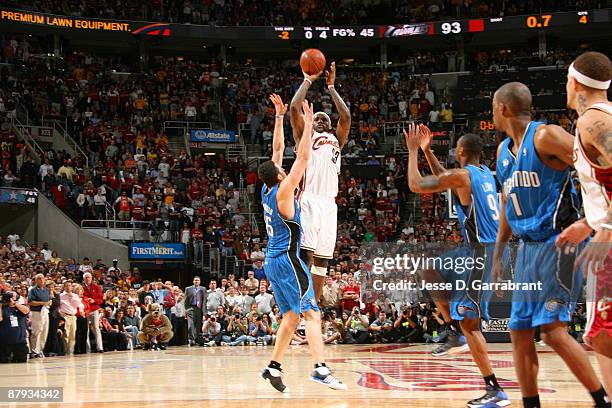 LeBron James of the Cleveland Cavaliers shoots the game-winning shot against Hedo Turkoglu of the Orlando Magic in Game Two of the Eastern Conference...