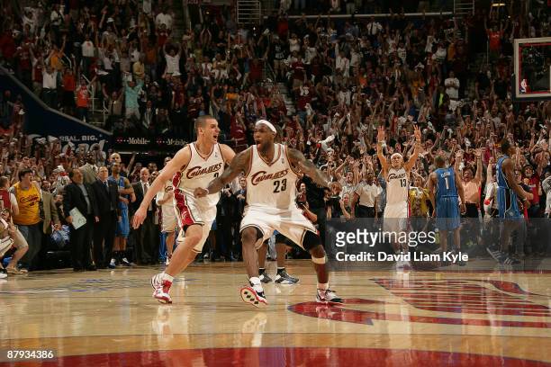 LeBron James of the Cleveland Cavaliers celebrates his game winning three alongside Sasha Pavlovic in the game against the Orlando Magic in Game Two...