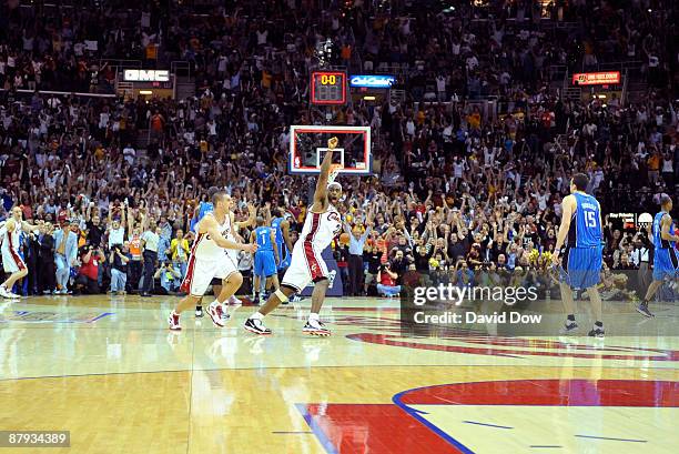 LeBron James of the Cleveland Cavaliers celebrates after hitting the game-winning shot against the Orlando Magic in Game Two of the Eastern...