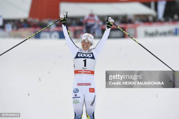 Charlotte Kalla of Sweden reacts after winning the Ladies' cross country skiing 10km free style pursuit competition of the FIS World Cup Ruka Nordic...