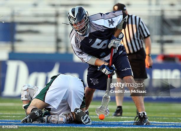 Alex Smith of the Washington Bayhawks wins a face off from Pete Vlahakis of the Long Island Lizards during their Major League Lacrosse game on May...