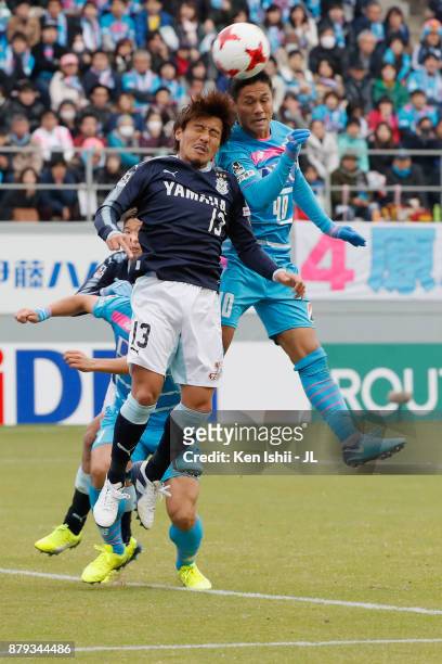 Yuji Ono of Sagan Tosu and Tomohiko Miyazaki of Jubilo Iwata compete for the ball during the J.League J1 match between Sagan Tosu and Jubilo Iwata at...