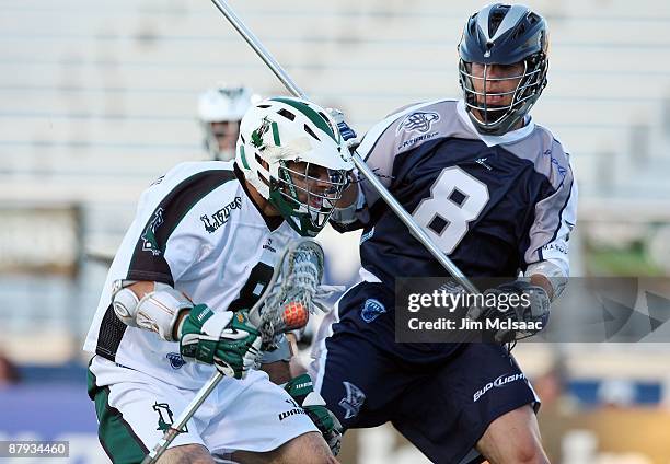 Pete Vlahakis of the Long Island Lizards controls the ball against Greg Vetter of the Washington Bayhawks during their Major League Lacrosse game on...