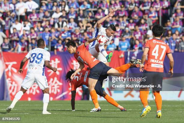 Dudu of Ventforet Kofu controls the ball under pressure of Caue a nd Kohei Yamakoshi of Omiya Ardija during the J.League J1 match between Omiya...