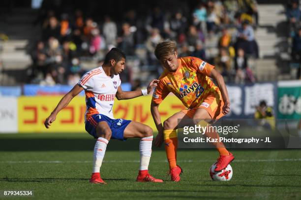 Ko Matsubara of Shimizu S-Pulse and Rony of Albirex Niigata compete for the ball during the J.League J1 match between Shimizu S-Pulse and Albirex...