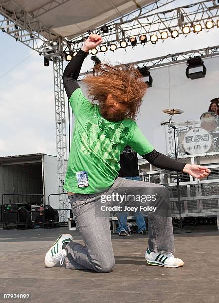 Caveman shows his rockstar skills onstage with 3 Door Down during the 2009 Miller Lite Carb Day concert at the Indianapolis Motor Speedway on May 22,...