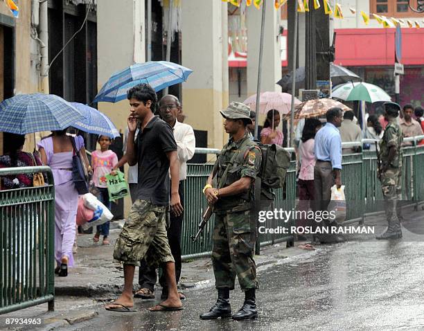 Sri Lankan soldiers secure the road leading to the temple site in Kandy on May 23 ahead of a visit by UN Secretary General Ban Ki-moon. UN chief Ban...