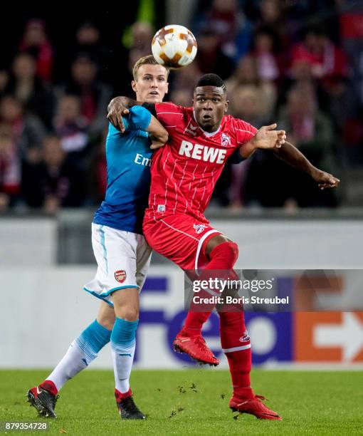 Jhon Cordoba of 1.FC Koeln battles for the ball with Rob Holding of Arsenal during the UEFA Europa League group H match between 1. FC Koeln and...