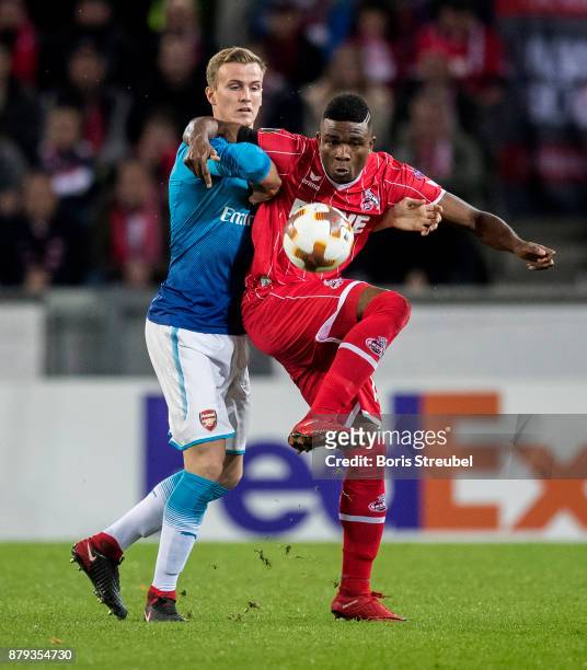 Jhon Cordoba of 1.FC Koeln battles for the ball with Rob Holding of Arsenal during the UEFA Europa League group H match between 1. FC Koeln and...