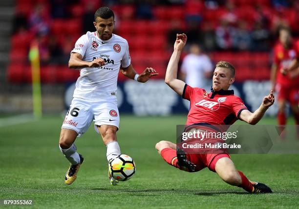 Jaushua Sotirio of West Sydney Wanderers tackled by Ryan Kitto of Adelaide United during the round eight A-League match between Adelaide United and...