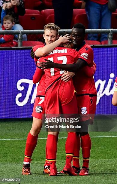 Ryan Kitto of Adelaide United celebrates his second goal with team mates during the round eight A-League match between Adelaide United and the...