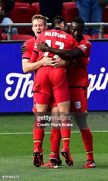 Ryan Kitto of Adelaide United celebrates his second goal with team mates during the round eight A-League match between Adelaide United and the...