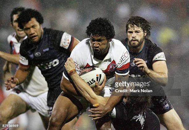 Frank-Paul Nuuausala of the Roosters is tackled by Jarrod Sammut of the Panthers during the round 11 NRL match between the Penrith Panthers and the...