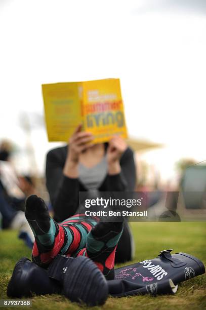 Woman reads a book in fine weather during the third day of the Guardian Hay Festival, Sky Arts once again returns to The Guardian Hay Festival 2009...