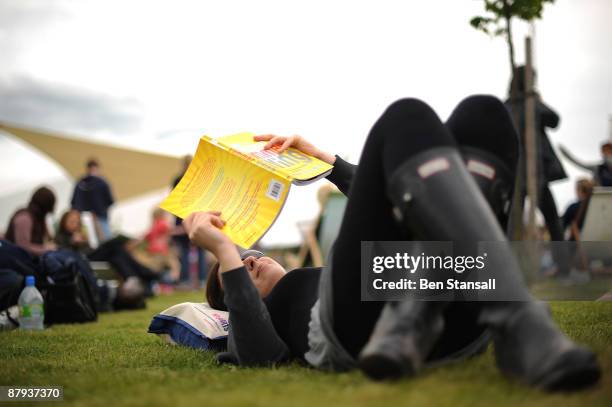 Woman reads a book in fine weather during the third day of the Guardian Hay Festival, Sky Arts once again returns to The Guardian Hay Festival 2009...