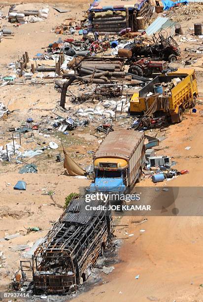 General view of destroyed trucks in the abandoned 'conflict zone' where Tamil Tigers separatists made their last stand before their defeat by the Sri...
