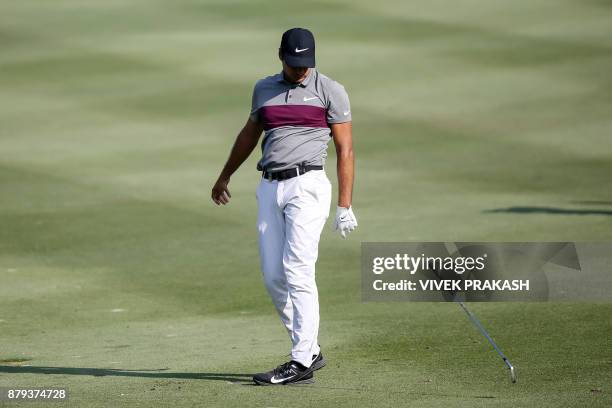 Julian Suri of the U.S. Drops his club after his shot landed in the bunker on the 14th hole during the final round of the Hong Kong Open golf...