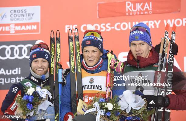 2nd placed Martin Johnsrud Sundby of Norway, his compatriot and winner Johannes Hoesflot Klaebo and 3rd placed Alexander Bolshunov of Russia pose on...