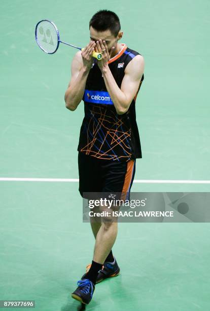 Malaysia's Lee Chong Wei reacts after winning the men's singles final against China's Chen Long at the Hong Kong Open badminton tournament in Hong...