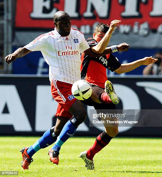 Uemit Korkmaz of Frankfurt battles for the ball with Guy Demel of Hamburg during the Bundesliga match between Eintracht Frankfurt and Hamburger SV at...