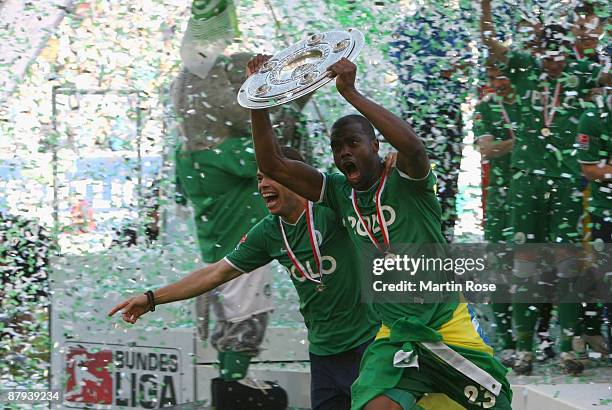 Grafite of Wolfsburg runs with the German Championship trophy after the Bundesliga match between VfL Wolfsburg and Werder Bremen at the Volkswagen...