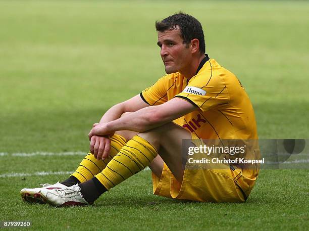 Alexander Frei of Dortmund sits on the pitch looking dejected after the 1-1 draw after the Bundesliga match between Borussia Moenchengladbach and...