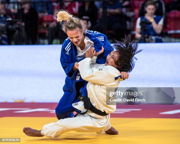 Daria Bilodid of Ukraine throws Otgontsetseg Galbadrakh of Kazakhstan for a wazari after four and a half minutes of extra time to win the u48kg gold...