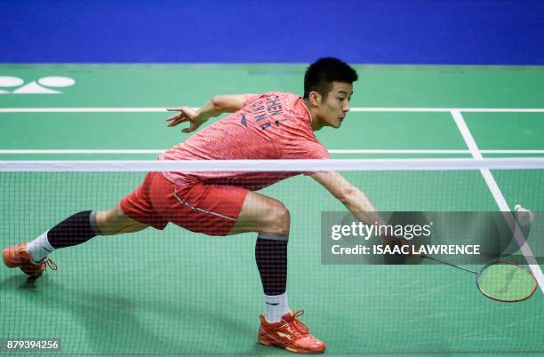 China's Chen Long hits a shot against Malaysia's Lee Chong Wei during the men's singles final at the Hong Kong Open badminton tournament in Hong Kong...