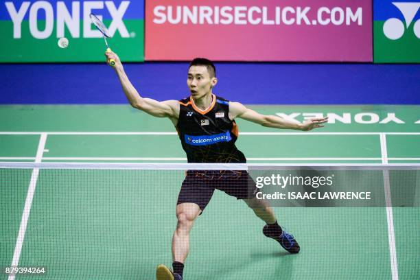 Malaysia's Lee Chong Wei hits a shot against China's Chen Long during the men's singles final at the Hong Kong Open badminton tournament in Hong Kong...
