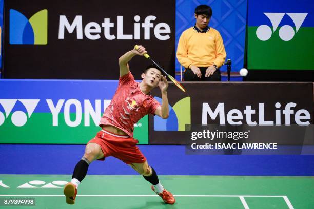 China's Chen Long hits a shot against Malaysia's Lee Chong Wei during the men's singles final at the Hong Kong Open badminton tournament in Hong Kong...