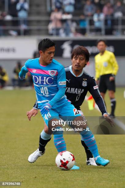 Yuji Ono of Sagan Tosu controls the ball under pressure of Tomohiko Miyazaki of Jubilo Iwata during the J.League J1 match between Sagan Tosu and...