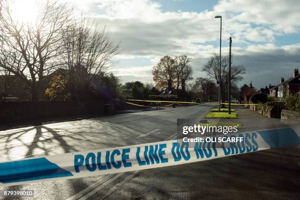 The site of a car crash in which five people, including three children, were killed after a stolen car crashed into a tree is cordoned off by police...