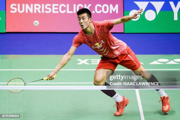 China's Chen Long hits a shot against Malaysia's Lee Chong Wei during the men's singles final at the Hong Kong Open badminton tournament in Hong Kong...