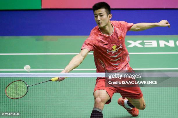 China's Chen Long hits a shot against Malaysia's Lee Chong Wei during the men's singles final at the Hong Kong Open badminton tournament in Hong Kong...