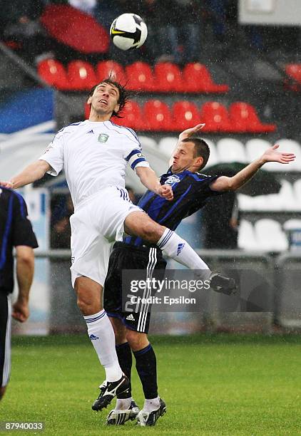 Andrei Koryaka of FC Saturn Moscow Oblast battles for the ball with Valeri Klimov of FC Tom', Tomsk during the Russian Football League Championship...